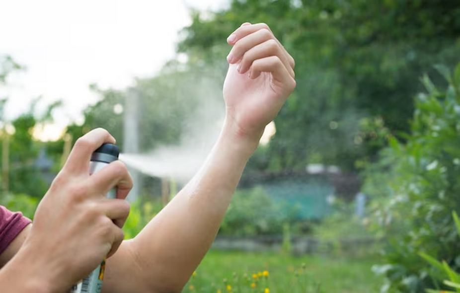 Insect repellent being applied to a hand