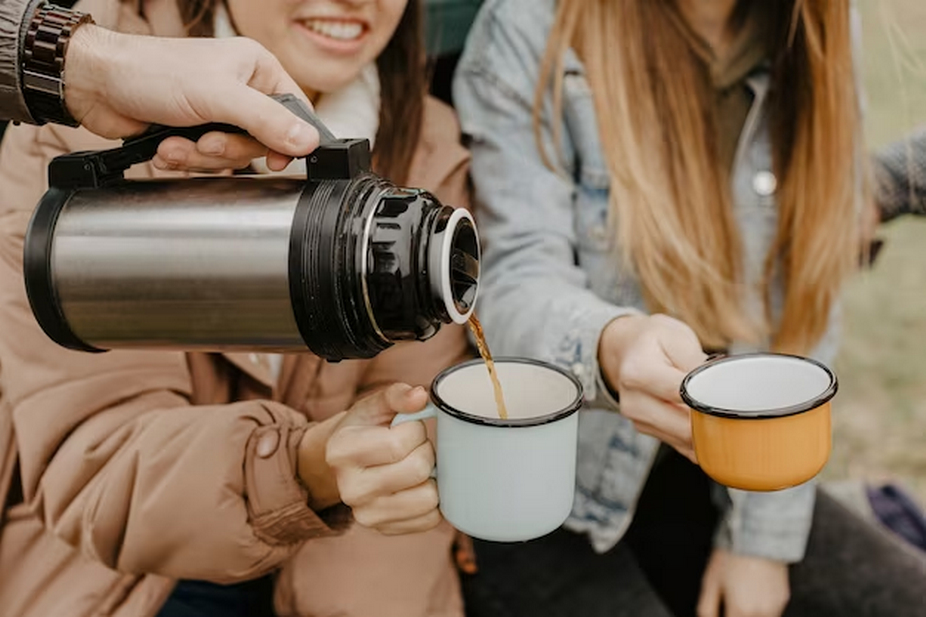 Thermos pouring beverages into cups