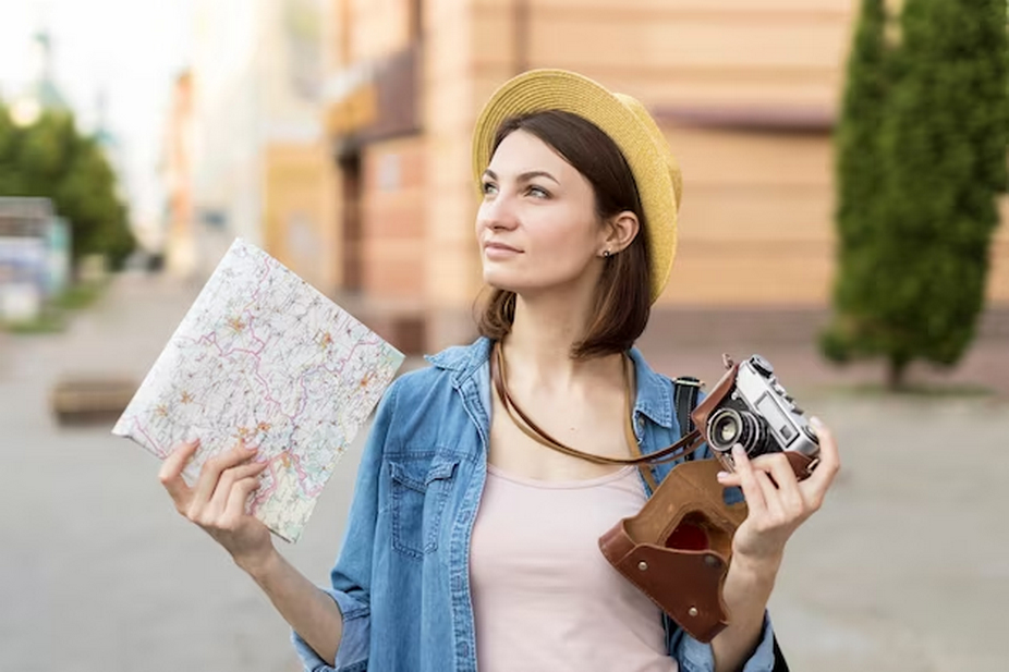 Woman with a camera and a map.